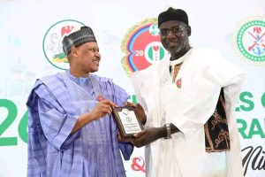 Buratai Takes Centre Stage as FG Honours Army Chiefs, Veterans at AFCRD 2026   Or  AFCRD 2026: FG Recognises Buratai’s Reforms, Sacrifice and National Service    The Federal Government has placed former Chief of Army Staff, Lieutenant General Tukur Yusuf Buratai (rtd), at the heart of the 2026 Armed Forces Celebration and Remembrance Day (AFCRD) honours, recognising his enduring legacy of service, sacrifice and institutional reforms within the Nigerian Army.    Buratai was conferred with the Legacy (Service and Sacrifice) Award at the AFCRD Gala Night held on Tuesday, 13 January 2026, at the Banquet Hall of the State House, Abuja. The award acknowledges his far-reaching reforms between 2015 and 2021, which expanded the Army’s operational capacity, strengthened counter-insurgency architecture, and repositioned the force for modern asymmetric warfare. It also recognises his post-service contribution as Nigeria’s Ambassador to the Republic of Benin.        Alongside Buratai, the Chief of Army Staff, Lieutenant General Waidi Shaibu, received the Service and Sacrifice Award for decisive leadership and selfless service in counter-insurgency and internal security operations across multiple theatres.       Other recipients in the same category include Major General Abdulsalami Enesi Abubakar, Theatre Commander, Operation HADIN KAI, and Major General Faruk Mijinyawa, former General Officer Commanding, 81 Division, Lagos, for exceptional operational leadership and commitment to duty.       The Gallantry Award was presented to Brigadier General Misa Uba for leading troops from the front during counter-insurgency operations in Borno State. Brigadier General Usman Ahmad received the Mission Success Award for repelling repeated terrorist attacks and sustaining operational effectiveness under intense pressure.     In the area of innovation, Colonel Ibrahim Mohammed Gero was honoured with the Innovation Award for designing and deploying a redesigned ballistic gunboat that significantly enhanced operations under Operation DELTA SAFE.       The late Colonel B. Umaru was posthumously awarded the Intelligence, Surveillance and Reconnaissance (ISR) Excellence Award for outstanding intelligence leadership during Operation HADIN KAI. The late Lieutenant Colonel Thomas Ebisingha Alari received the Fallen Heroes Award for gallantry and pivotal roles in major counter-terrorism operations in the North-East     . Beyond Buratai, several retired senior officers were honoured for sustained national contributions. Brigadier General Sani Kukasheka Usman (rtd) received the Sentinel of Freedom Award for strategic military communication, peacekeeping and advocacy for veterans’ welfare and national security. Major General Mohammed Sadiq Aliyu (rtd) was presented with the Phoenix Award for resilience and continued service despite being wounded in action during counter-insurgency operations.         Colonel Olubunmi Oyekola (rtd) received the Entrepreneurial Spirit Award for successfully transitioning military discipline into a thriving hospitality enterprise, while Colonel Bartholomew Chukwuemeka Ogbonna (rtd) was honoured with the Community Champion Award for grassroots development, healthcare support and youth mobilisation.       Master Warrant Officer Manu Garba was awarded the Distinguished Citizen Service Medal for 35 years of meritorious service and sustained post-retirement community development initiatives.      Remembering Sacrifice, Celebrating Legacy The Armed Forces Celebration and Remembrance Day remains Nigeria’s annual platform for honouring fallen heroes, celebrating serving personnel and recognising veterans whose courage and professionalism continue to safeguard the nation’s sovereignty, with Buratai’s recognition standing as a defining symbol of long-term military leadership and national service.